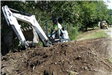 Excavator Digging up Roots
