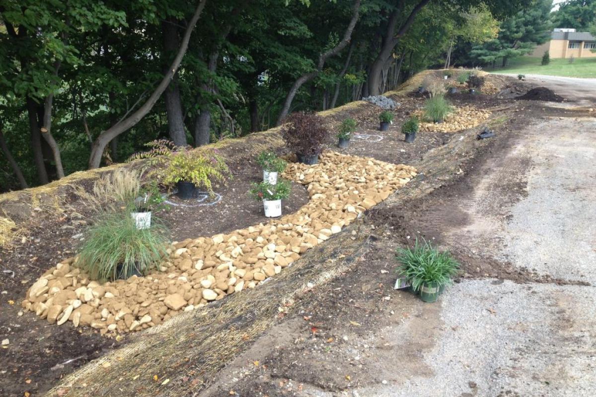 Shrubs and River Rock Being Installed